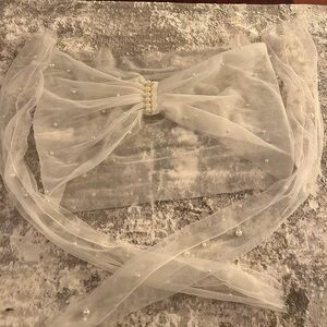 Ivory wrap with sleeves embellished with pearls